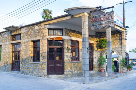 POLIS, CYPRUS - AUGUST 3, 2014: The small family restaurant located on the central street and boasts local wines and cuisine, on August 3 in Polis.のeditorial素材