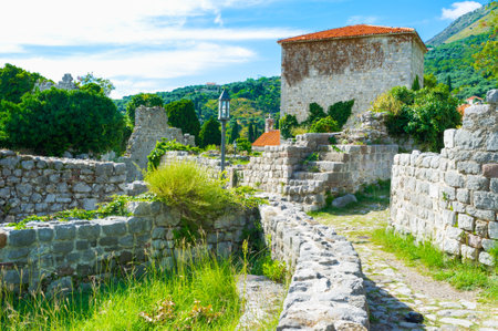 The narrow empty street of the old ruined fortress, that was left after the earthquake, Stari Bar, Montenegro.のeditorial素材