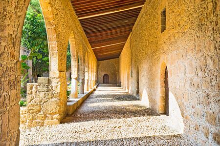 The cozy and shady gallery was attached to the monastery rampart around its inner perimeter, Ayia Napa, Cyprus.の写真素材