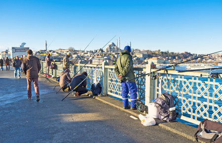 ISTANBUL, TURKEY - JANUARY 13, 2015: The fishing on Galata bridge is the popular time spending among the turks, on January 13 in Istanbul.のeditorial素材