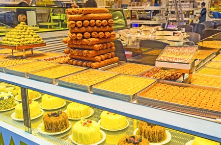 ISTANBUL, TURKEY - JANUARY 13, 2015: The Middle Eastern sweets, such as baklava, fingers, burma, kunufa and nabulsi at the storefront, on January 13 in Istanbul.のeditorial素材