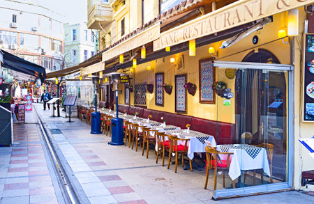 ISTANBUL, TURKEY - JANUARY 13, 2015: The narrow street in the tourist neighborhood is the best place for the cozy cafe or restaurant, on January 13 in Istanbul.のeditorial素材