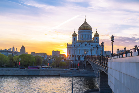 The scenic sunset over the Cathedral of Christ the Sarviour with the Moskva river on the foreground Moscow Russiaの写真素材