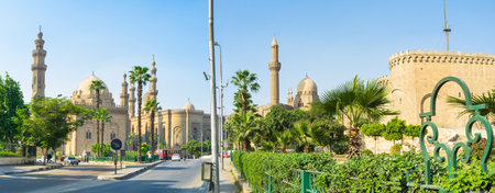 The medieval mosques and the Saladin citadel surrounded by the scenic green gardens, Cairo, Egypt.のeditorial素材