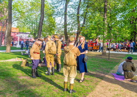 MOSCOW, RUSSIA - MAY 9, 2015: The actors in costumes of the Red Army soldiers on the festival in Hermitage park, on May 9 in Moscow.のeditorial素材