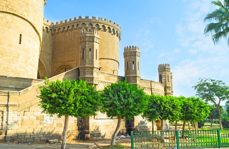 The high stone walls of the Saladin Citadel, surrounded by lush garden, Cairo, Egypt.のeditorial素材