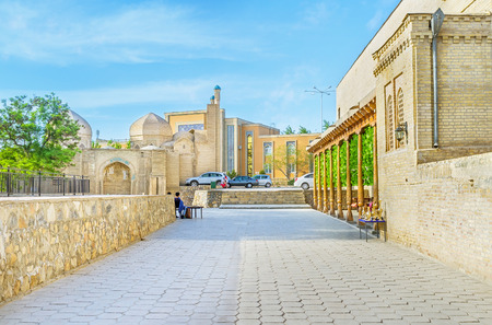 The old street with the Magoki-Attari mosque on the background, Bukhara, Uzbekistan.の写真素材