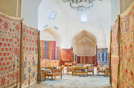 BUKHARA, UZBEKISTAN - APRIL 28, 2015: The large trading dome serves as the workshop and rug store with the cozy cafe in the middle of the hall, on April 28 in Bukhara.のeditorial素材