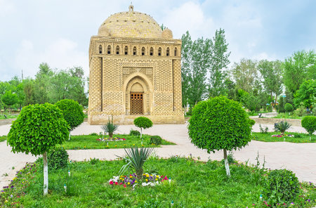 The Mausoleum of Ismail Samani surrounded by the scenic park with beautiful flower beds, Bukhara, Uzbekistan.のeditorial素材