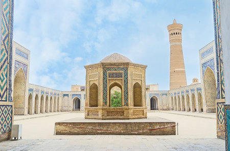 The sheikh tomb in the courtyard of Kalyan Mosque with the Great Minaret on the background, Bukhara, Uzbekistan.のeditorial素材