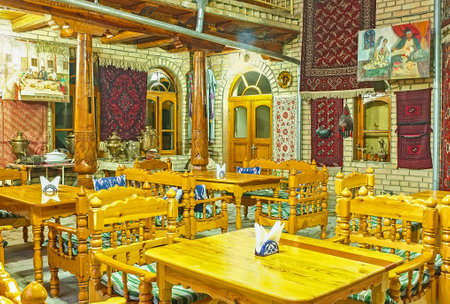 BUKHARA, UZBEKISTAN - APRIL 28, 2015: The traditional teahouse decorated with the silk carpets on the walls, on April 28 in Bukhara.のeditorial素材