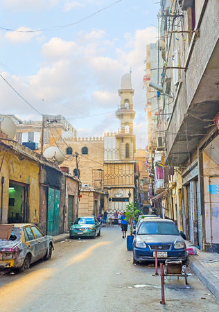 ALEXANDRIA, EGYPT - OCTOBER 11, 2014: The small mosque with unusual half-minaret located on the narrow dusty street, on October 11 in Alexandria.のeditorial素材