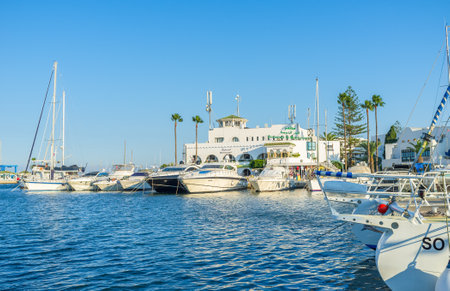 EL KANTAOUI, TUNISIA - AUGUST 29, 2015: The dazzling white yachts are moored in port, on August 29 in El Kantaoui.のeditorial素材