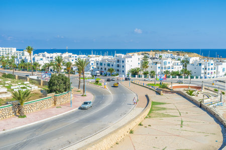 The neighborhood of the white hotels and restaurants surrounds the small fishing port, Monastir, Tunisia.のeditorial素材