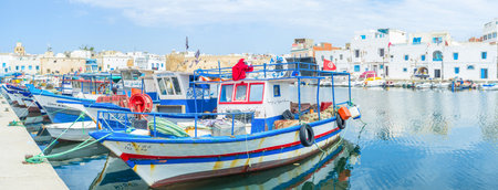 BIZERTE, TUNISIA - SEPTEMBER 4, 2015: All the fishing boats in the old port are ready for work, on September 4 in Bizerte.のeditorial素材