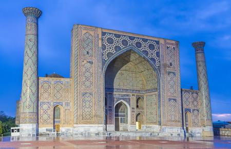 The bright illumination of Ulugh Beg Madrasah on the Registan Square, Samarkand, Uzbekistan.の写真素材