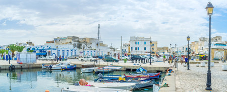 BIZERTE, TUNISIA - SEPTEMBER 4, 2015: The lazy atmosphere of mediterranean port makes it the best...
