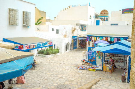 HAMMAMET, TUNISIA - SEPTEMBER 6, 2015: The tourist market located next to the Kashbah walls, on...