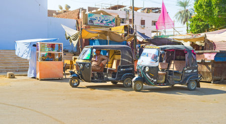 EDFU, EGYPT - OCTOBER 7, 2014: The tuk-tuk taxis on the parking in the town center, on October 7 in...
