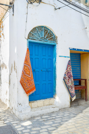 The small carpets on the street are the commercial of the rug stall, Sousse, Tunisia.の写真素材
