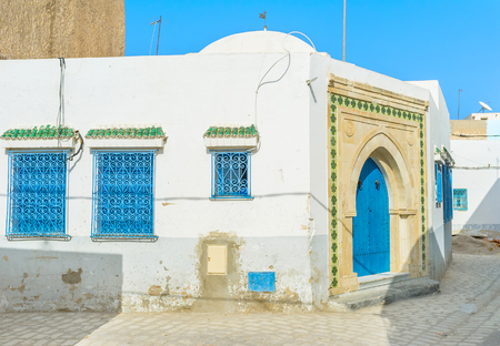 The small mosque in the middle of Medina with the beautiful blue door, Sousse, Tunisia.の写真素材