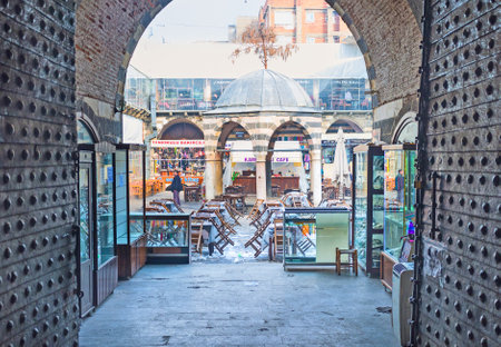 DIYARBAKIR, TURKEY - JANUARY 15, 2015: The view through the arch on the old stone fountain in the courtyard of the former Hasan Pasha Inn, on January 15 in DiyarbakÄ±r.のeditorial素材