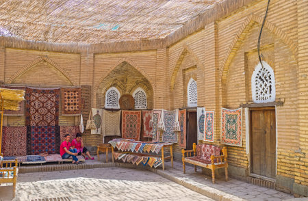 KHIVA, UZBEKISTAN - MAY 3, 2015: The best way to discover the old eastern crafts is to visit the woven rugs  workshop and enjoy the traditional Uzbek art, on May 3 in Khiva.のeditorial素材