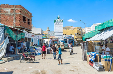 KAIROUAN, TUNISIA - AUGUST 30, 2015: The arabic market is crowded and noisy place with the wide range of goods on each taste, on August 30 in Kairouan.のeditorial素材