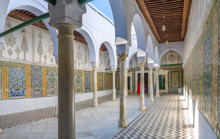 KAIROUAN, TUNISIA - AUGUST 30, 2015: The covered terrace of Zaouia Sidi Sahab decorated with the patterns of carved plaster and glazed tiles, on August 30 in Kairouan.のeditorial素材