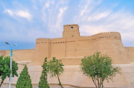 The high ramparts of Kunya-Ark, the old inner town fortress with the tower, located inside it, Khiva, Uzbekistan.のeditorial素材