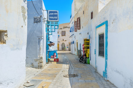 KAIROUAN, TUNISIA - AUGUST 30, 2015: THe tiny stalls and mini shops are the main trading zone in Medina, on August 30 in Kairouan.のeditorial素材