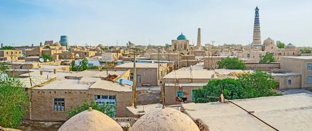 The cityscape of medieval Khiva with its highest landmarks - Islam Khoja Minaret, Pahlavon Mahmud Mausoleum and Kalta Minor Minaret, Uzbekistan.の写真素材