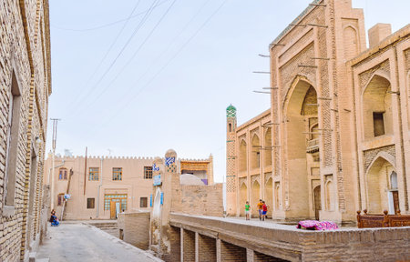 KHIVA, UZBEKISTAN - MAY 3, 2015: The old brick madrasah waits for restoration, on May 3 in Khiva.のeditorial素材