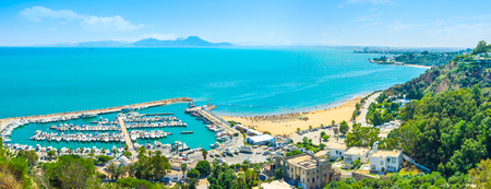 The scenic coastline of Sidi Bou Said with the large haven, full of yachts, Tunisia.の写真素材