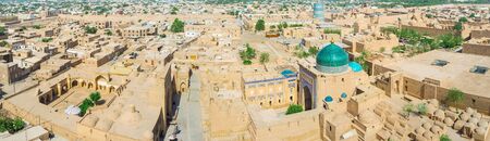 The medieval Khiva mostly built of bricks, so from the air it looks like the sand desert with the colorful domes and minarets, Uzbekistan.の写真素材