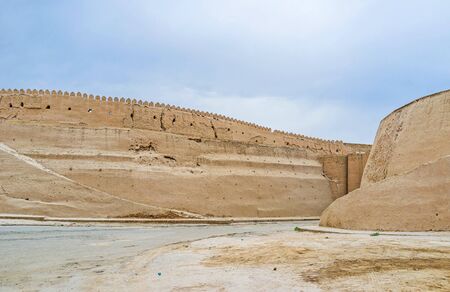 The huge ramparts of Itchan Kala are well preserved brick and clay walls, surrounding the medieval town, Khiva, Uzbekistan.の写真素材