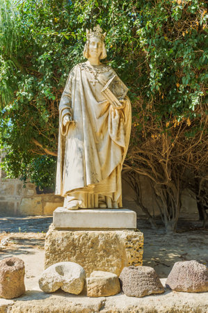 CARTHAGE, TUNISIA - SEPTEMBER 2, 2015: The stone statue of medieval king on the territory of archaeological site, on September 2 in Carthage.のeditorial素材