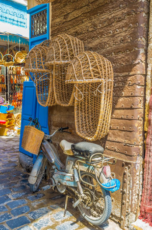 SFAX, TUNISIA - SEPTEMBER 3, 2015: The wicker baby carriages in the market stall next to Bab Diwan Gates, on September 3 in Sfax.のeditorial素材