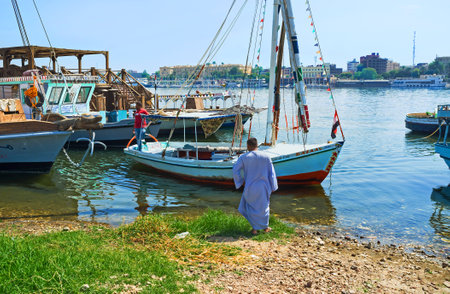 LUXOR, EGYPT - OCTOBER 8, 2014: The felucca prepairs to move off from the West bank of Nile river, on October 8 in Luxor.のeditorial素材