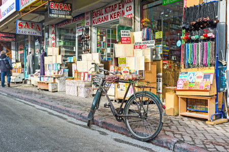 KONYA, TURKEY - JANUARY 20, 2015: The  cycle next to the Islamic book shop in the market quarter of old town, on January 20 in Konya.のeditorial素材