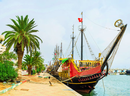 SOUSSE, TUNISIA - SEPTEMBER 6, 2015: The  flotilla of the medieval worships moored next to the central city promenade, on September 6 in Sousse.のeditorial素材