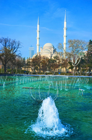KONYA, TURKEY - JANUARY 20, 2015: The scenic white minarets of Haciveyiszade Mosque, hiden behind the trees of city park, on January 20 in Konya.のeditorial素材