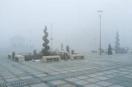 KONYA, TURKEY - JANUARY 20, 2015: The misty winter morning on the central square in front of Mevlana Museum and Selimiye Mosque, on January 20 in Konya.のeditorial素材