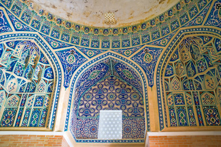 TASHKENT, UZBEKISTAN - MAY 5, 2015: The wall and window frame in Qaldirghochbiy Mausoleum decorated with painted islamic patterns and glazed tiles, on May 5 in Tashkent.のeditorial素材