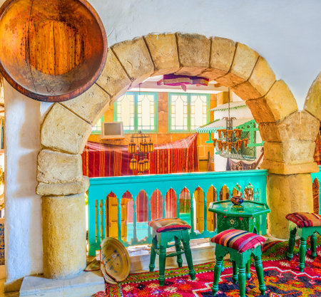 SOUSSE, TUNISIA - SEPTEMBER 1, 2015: The small tables and chairs for drinking tea in old arabic restaurant, on September 1 in Sousse.のeditorial素材