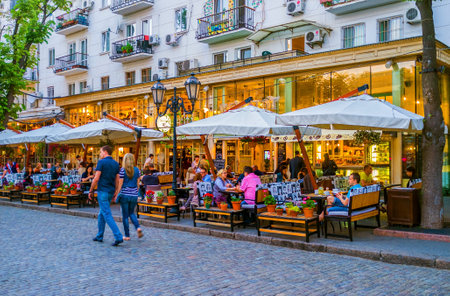 ODESSA, UKRAINE - MAY 17, 2015: The best way to relax in the evening in Odessa is to have a supper in summer terrace in on of the restaurants, on May 17 in Odessa.のeditorial素材