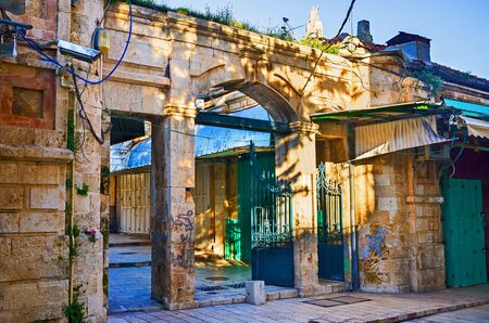 The Aftimos bazaar separated by the old stone gateways from the neighboring streets, Jerusalem, Israel.の写真素材