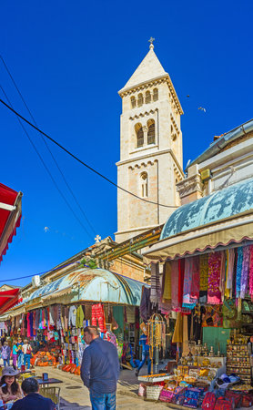 JERUSALEM, ISRAEL - FEBRUARY 16, 2016: The white stone belfry of the Lutheran Kirche rises over the stalls of the Aftimos Suq, on February 16 in Jerusalem.のeditorial素材