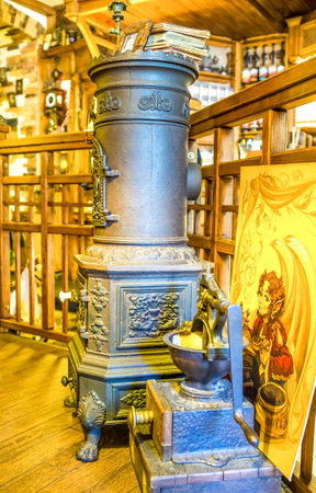 ODESSA, UKRAINE - MAY 18, 2015: The cast iron potbelly stove is an element of decoration of the local cafe in old Odessa, on May 18 in Odessa.のeditorial素材