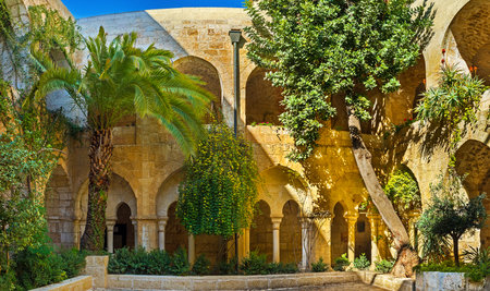 JERUSALEM, ISRAEL - FEBRUARY 16, 2016: The scenic green garden in courtyard of Lutheran Kirche of the Redeemer, on February 16 in Jerusalem.のeditorial素材